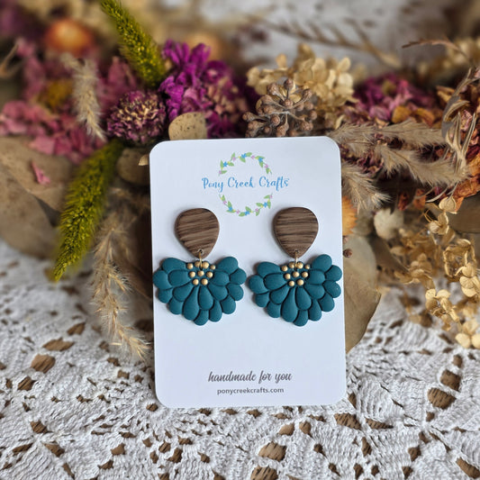 Embossed floral statement design in dark teal with faux wood findings