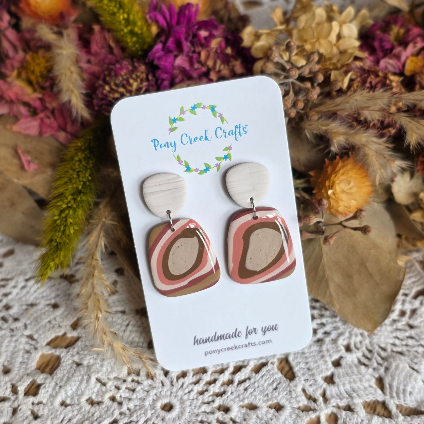 Rust toned statement piece with off-white faux wood findings