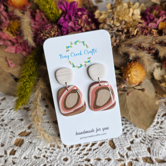 Rust toned statement piece with off-white faux wood findings