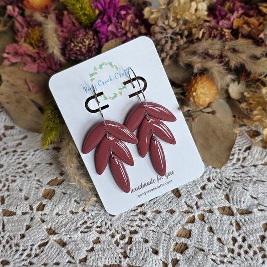 Muted maroon toned three tier statement piece with silver accent hoops