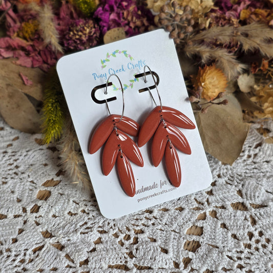 Burnt orange three tier statement piece with silver accent hoop findings