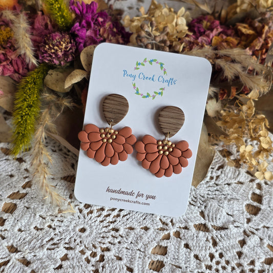 Embossed florals in burnt orange with faux wood findings