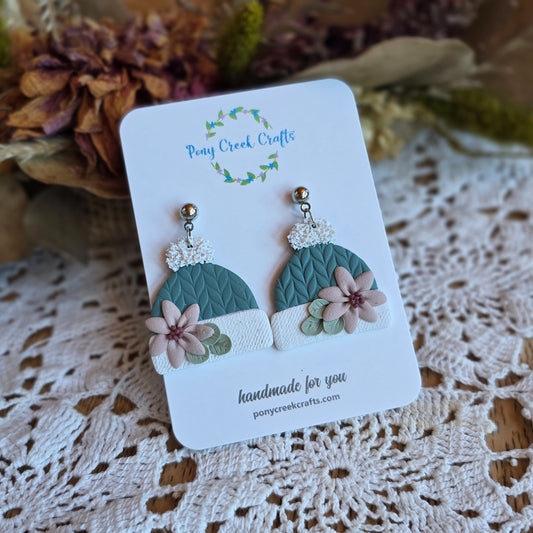 Stocking cap in winter sage with muted pink floral accent earrings