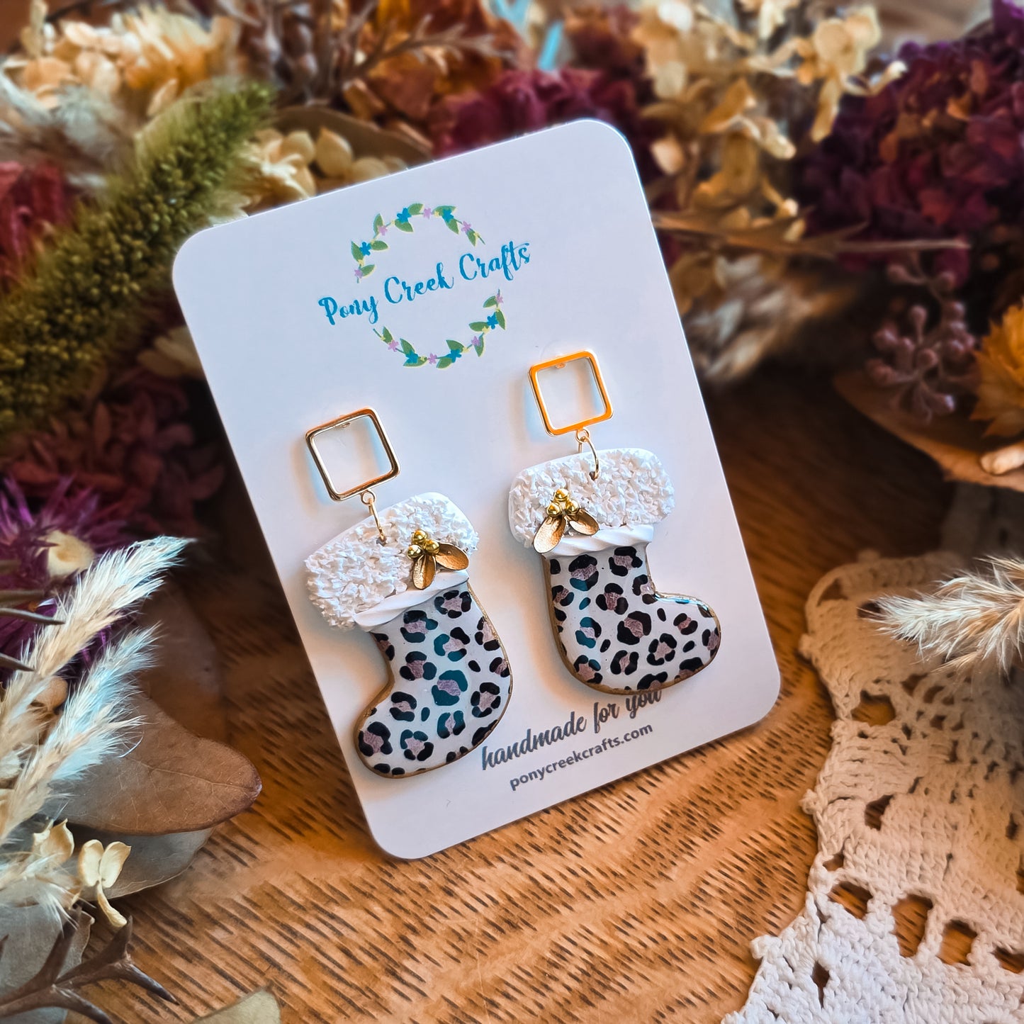 Stocking shaped earrings in leopard print with gold floral accents