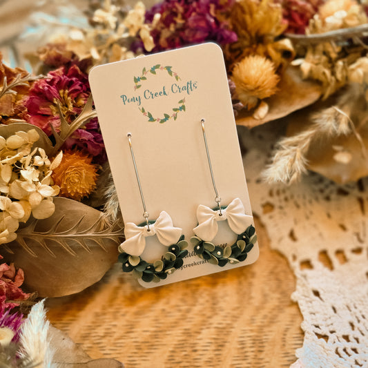 Winter wreath with white accent bow and french hook findings