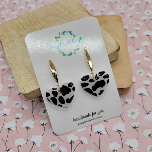 Black and white cow print heart and gold finding