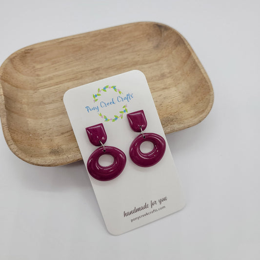 Dusty purple colored organic shaped earrings with resin finish