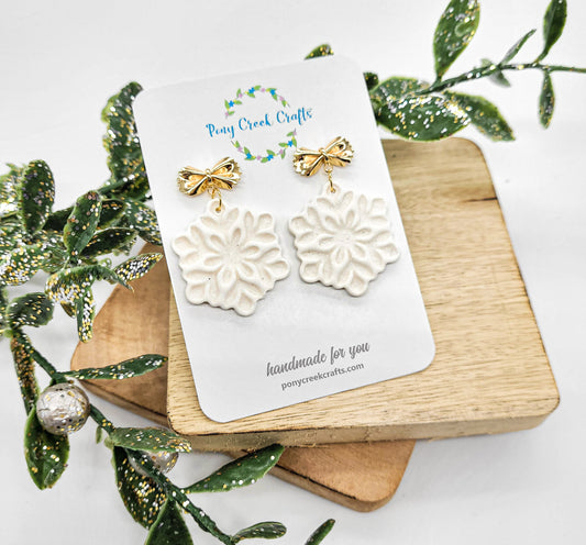 Shimmering Snowflake earrings with gold accent bow findings