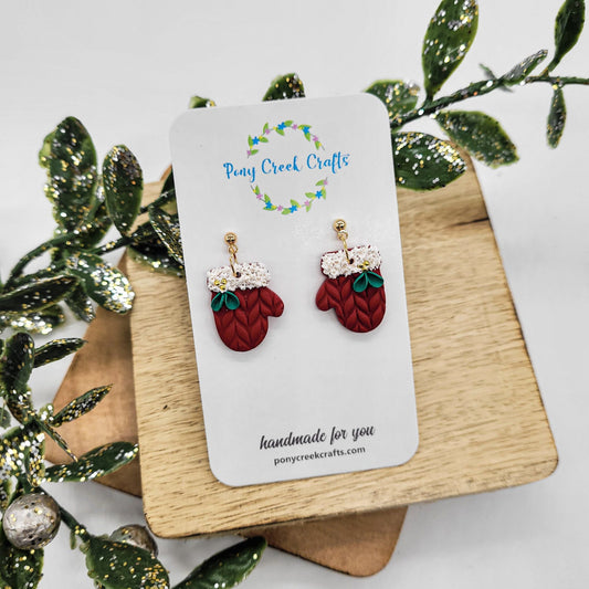 Red mitten earrings with holiday berry and floral accents