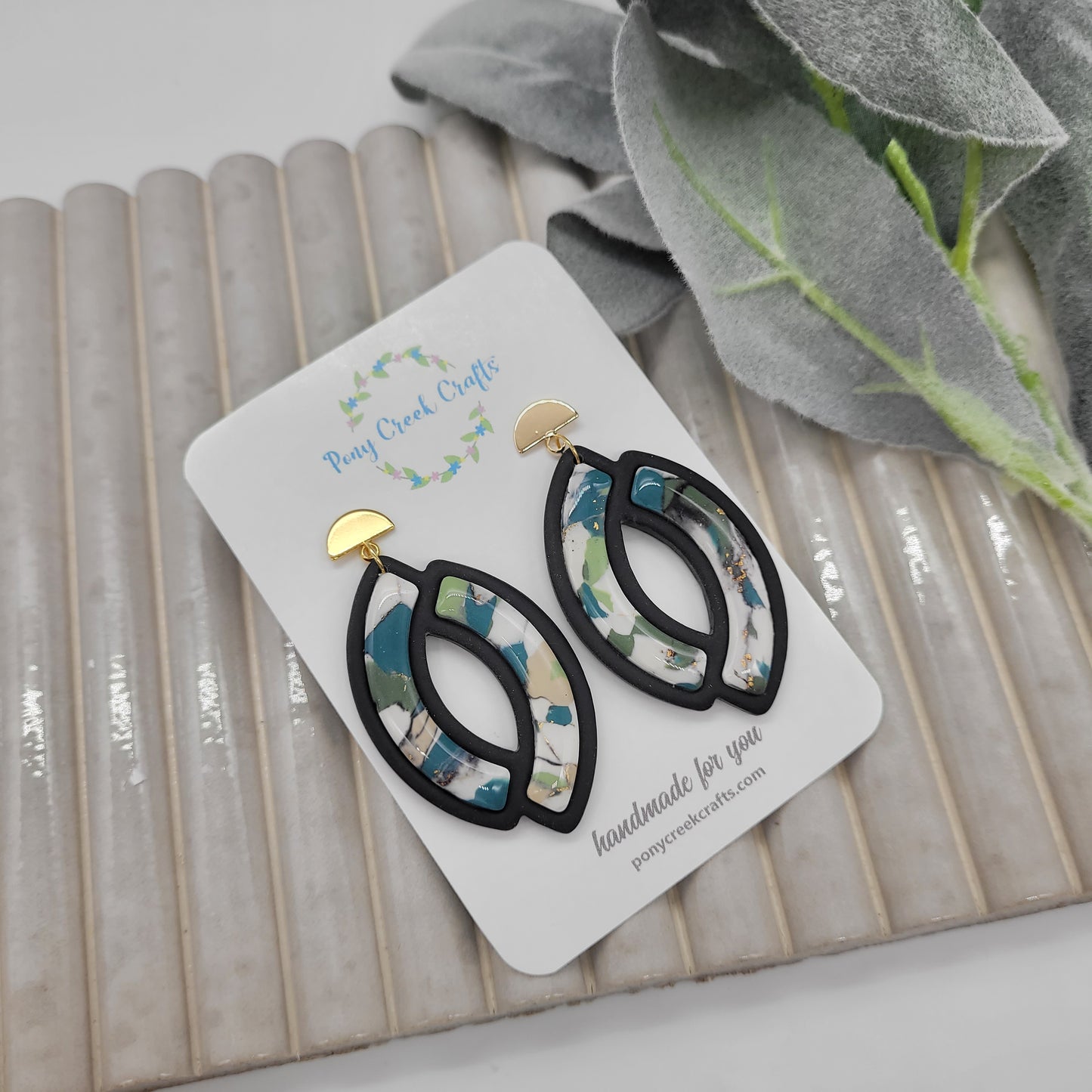 Blue-green and black accent earrings