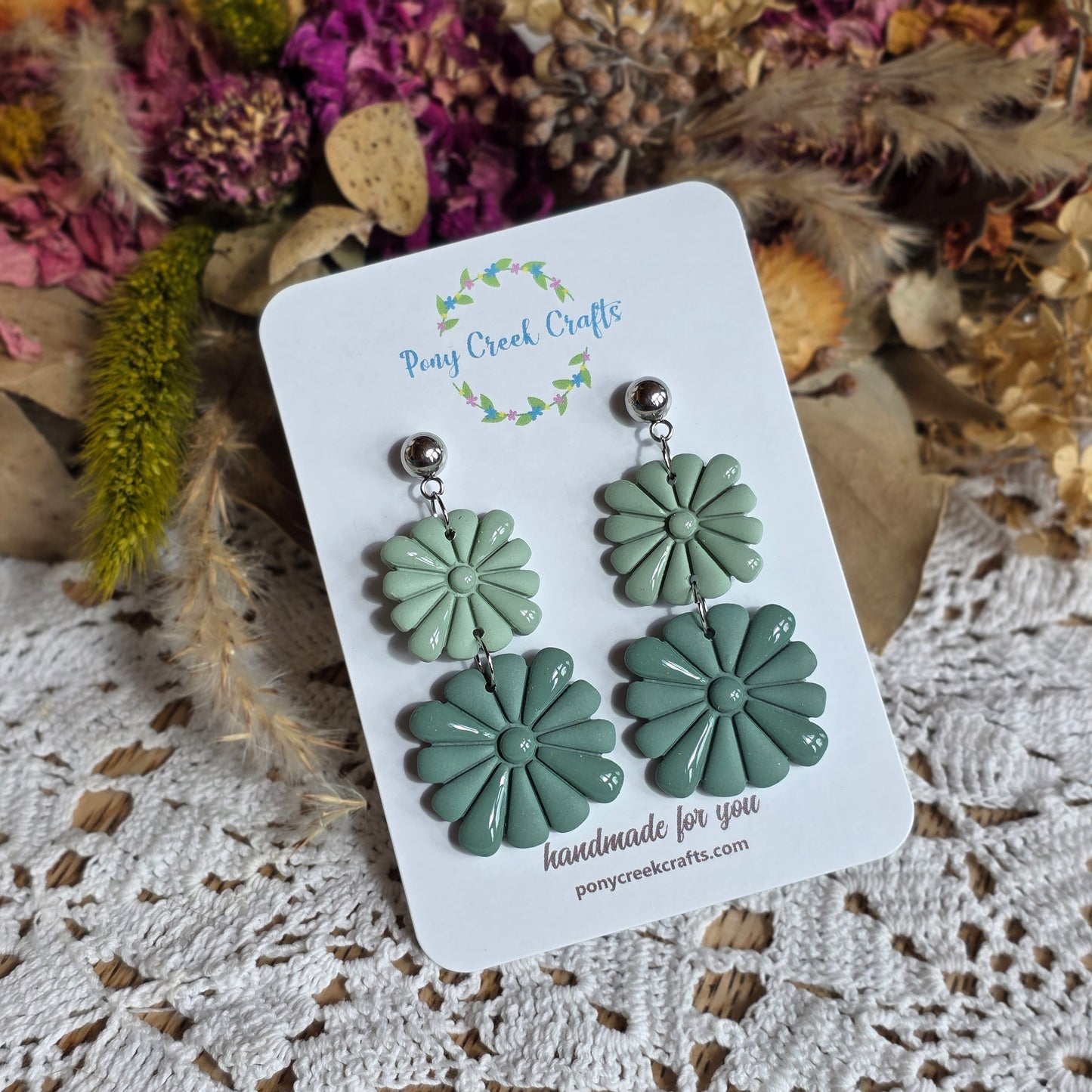 Muted blue-green embossed stacked statement piece