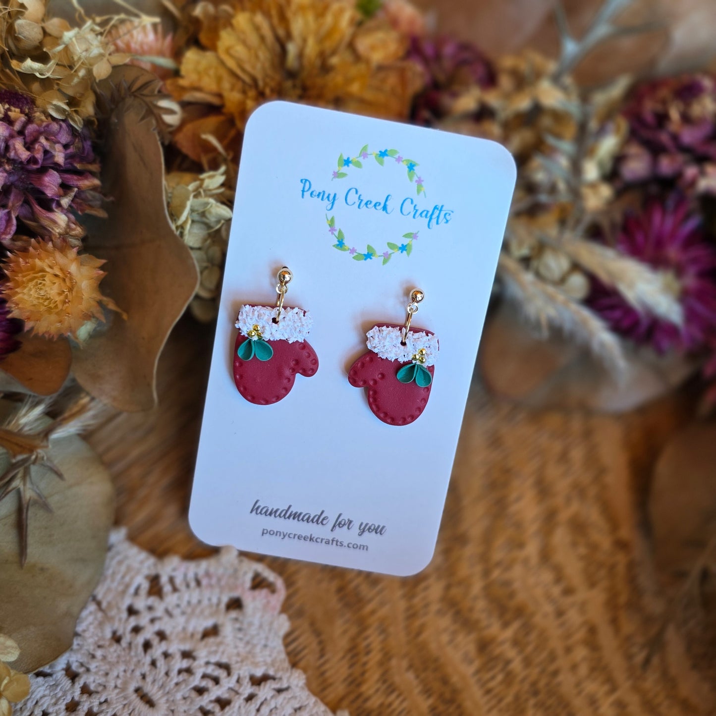 Mitten shaped earrings in red with gold and green floral accents