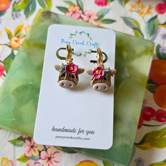Highland cow earrings with floral accent
